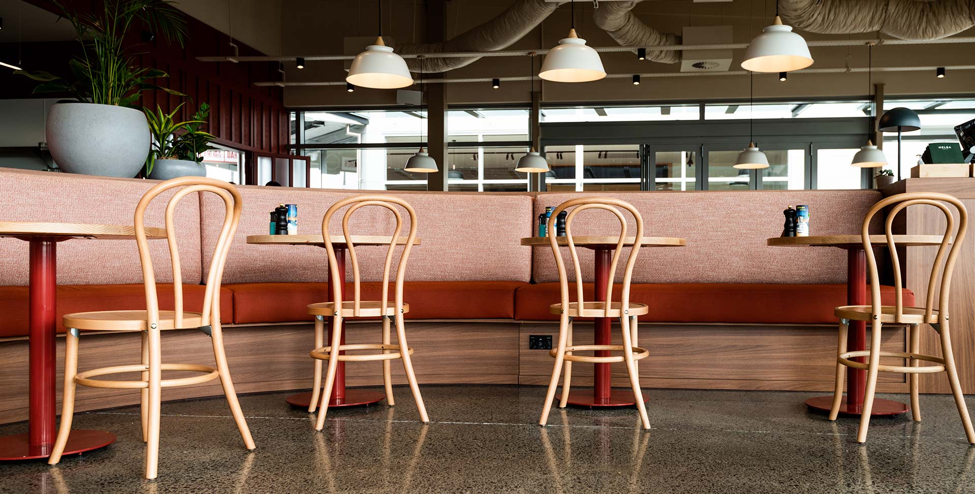 Image of a wooden table with chairs around it
